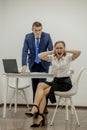 Angry boss yelling at his young employee, she is stressed and feeling frustrated: hostile boss and mobbing concept Royalty Free Stock Photo