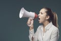 Angry bossy woman shouting through a megaphone