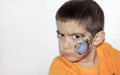 Angry boy with face painted with a spider Royalty Free Stock Photo