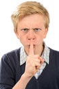 Angry boy with finger on lips Royalty Free Stock Photo