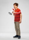 Angry boy speaking to megaphone Royalty Free Stock Photo