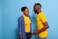 Angry boyfriend raising hand at girlfriend and arguing Royalty Free Stock Photo