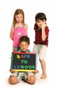 Angry Boys and Girl with Back To School Sign