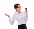 Angry brunette businesswoman with cell phone Royalty Free Stock Photo