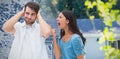 Composite image of angry brunette shouting at boyfriend Royalty Free Stock Photo