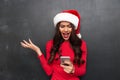 Angry brunette woman in red blouse and christmas hat screaming Royalty Free Stock Photo