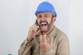 angry builder screams on phone