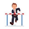 Angry business man running to a barrier obstacle Royalty Free Stock Photo