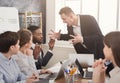 Angry business man screaming at employee in office