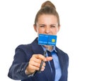 Angry business woman cutting credit card with scissors Royalty Free Stock Photo