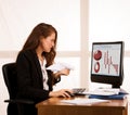 Angry business woman expressing rage at her desk in the office Royalty Free Stock Photo