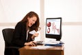 Angry business woman expressing rage at her desk in the office Royalty Free Stock Photo