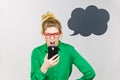 Angry business woman looking at phone, thinking bubble Royalty Free Stock Photo