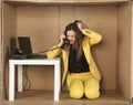 angry business woman pulls her hair during a telephone conversation