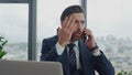 Angry businessman calling phone at office work desk closeup. Nervous manager . Royalty Free Stock Photo