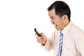 Angry businessman with cellphone Royalty Free Stock Photo