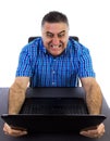 Angry businessman destroying his laptop