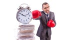 Angry businessman hitting clock isolated Royalty Free Stock Photo