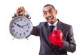Angry businessman hitting clock isolated Royalty Free Stock Photo