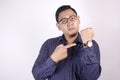 Angry Businessman Pointing at Wristwatch