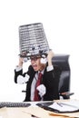 Angry businessman with rubbish bin on his head Royalty Free Stock Photo