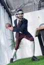 angry businessman in rugby helmet playing american football