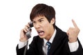 Angry businessman screaming on the phone Royalty Free Stock Photo