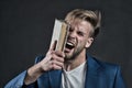 Angry businessman shout with book, knowledge Royalty Free Stock Photo