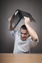 Angry businessman smashing his laptop Royalty Free Stock Photo