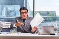 The angry businessman with too much work in office Royalty Free Stock Photo