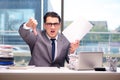 The angry businessman with too much work in office Royalty Free Stock Photo