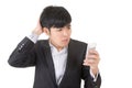 Angry businessman use cellphone Royalty Free Stock Photo