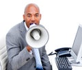 Angry businessman yelling through a megaphone Royalty Free Stock Photo