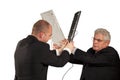 Angry businessmen fighting with keyboards