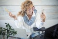 Angry businesswoman discussing and shouting at the phone in mobile call business Freelance working with problems. One woman Royalty Free Stock Photo