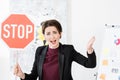 Angry businesswoman holding stop sign and screaming Royalty Free Stock Photo