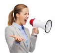 Angry businesswoman with megaphone Royalty Free Stock Photo