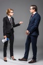 angry businesswoman with megaphone talking to businessman Royalty Free Stock Photo