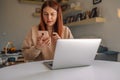 Angry businesswoman with negative surprised face looking something in smartphone in home office Royalty Free Stock Photo