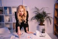 angry businesswoman pointing on documents on table and looking Royalty Free Stock Photo