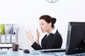 Angry businesswoman screaming to phone.