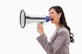 Angry businesswoman shouting through megaphone Royalty Free Stock Photo