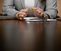 Angry businesswoman working late at desk Royalty Free Stock Photo