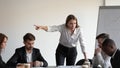 Angry caucasian female boss firing sad stressed african male worker Royalty Free Stock Photo