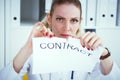 Angry Caucasian woman tears agreement documents in front of camera closeup. Royalty Free Stock Photo