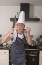 Angry chef holding a large knife Royalty Free Stock Photo