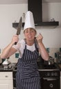 Angry chef holding a large knife Royalty Free Stock Photo