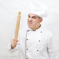 Angry chef with rolling pin Royalty Free Stock Photo