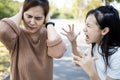 Angry child daughter shouting scolding at her mother about fussy things,nag,aggressive girl screaming,girl is going crazy,losing