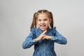 Angry child girl punching fist to fight, white background